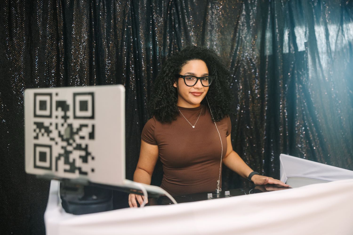 Omy The DJ at the booth mixing during a Jacksonville event